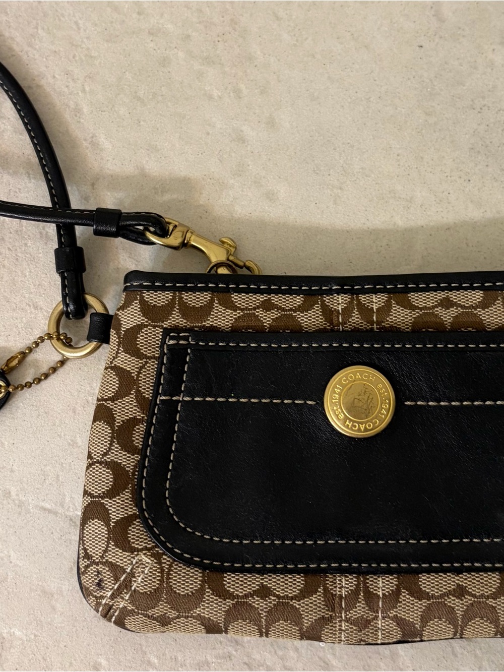 Coach Brown Signature Canvas Wristlet with Black Trim and Gold Accent